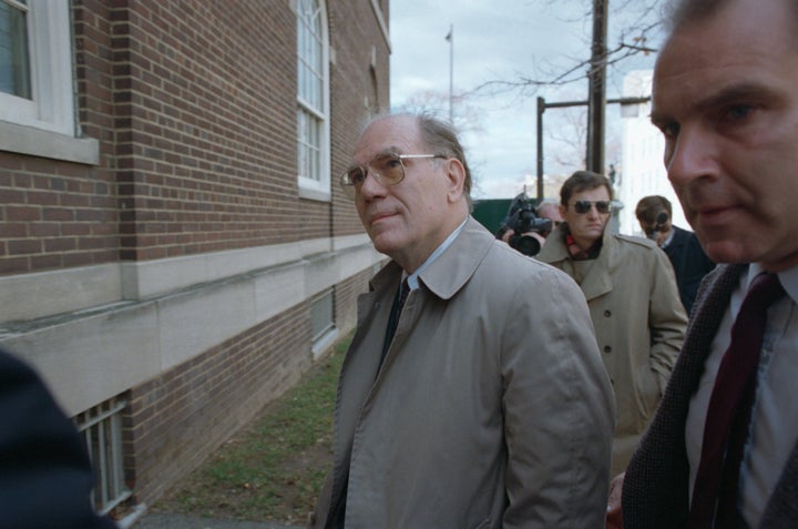 Lyndon LaRouche enters the United States District Court to face charges of mail fraud and tax evasion in 1988.