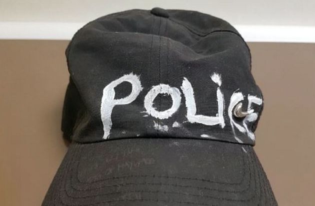 A crudely drawn hat was used to impersonate a police officer, Bristol Crown Court court heard.