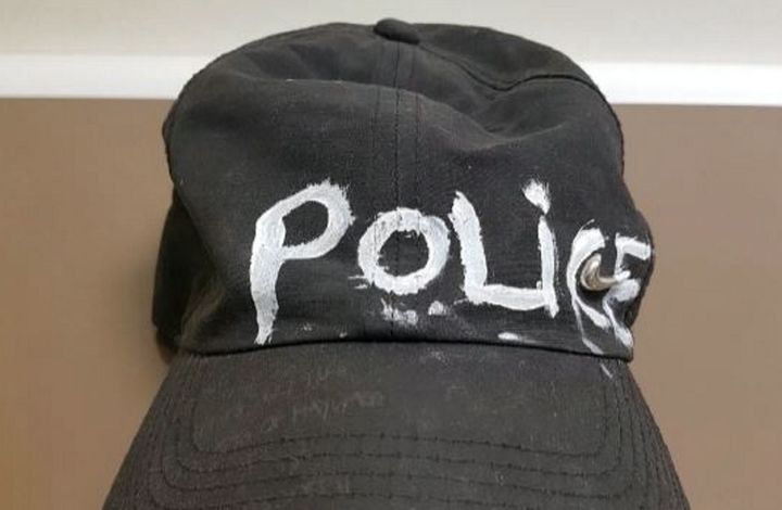 A crudely drawn hat was used to impersonate a police officer, Bristol Crown Court court heard.