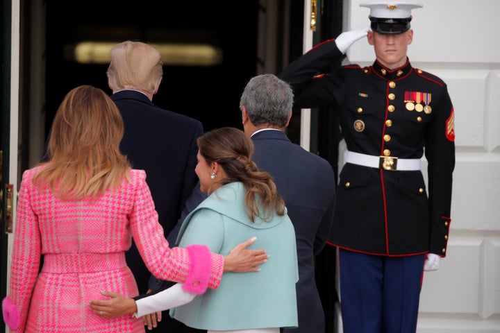 Melania Trump walking alongside Maria Juliana Ruiz Sandoval. 