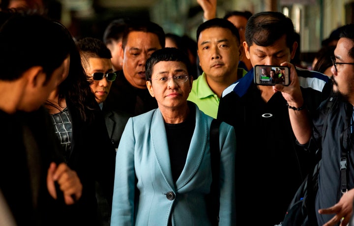 A day after being arrested on libel charges, Maria Ressa arrives at a court in Manila to post bail, Feb. 14. Her website, Rap