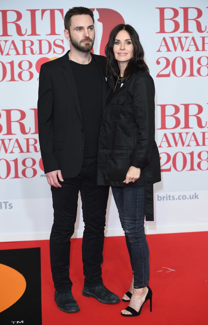 Courteney Cox and Johnny McDaid posing together. 