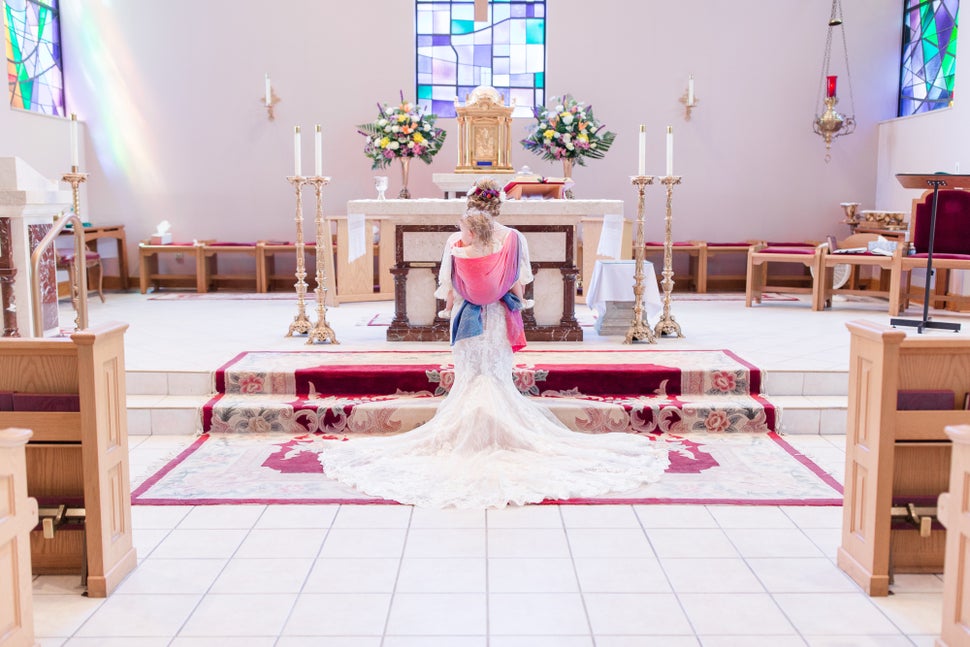 To incorporate her daughter into her wedding, Mort wore her toddler down the aisle and throughout the ceremony in a wrap.