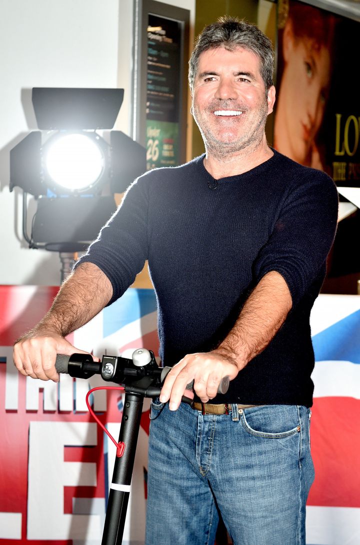 Simon Cowell on a scooter, for some reason