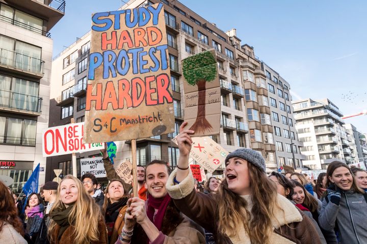 Students march during a climate change protest in Brussels, Thursday, Feb. 14, 2019. 