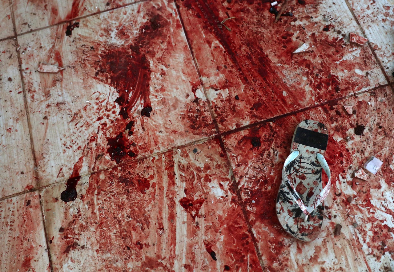 Blood stains the floor of a home near Rio's Santa Teresa neighborhood. Local residents say police killed at least 13 people in a Feb. 9, 2019, operation, including some who were shot execution-style inside the home.