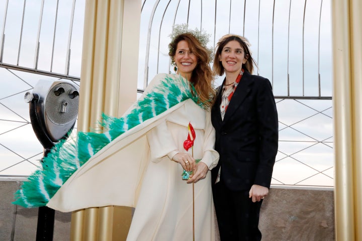 Helena Barquet (left) and Fabiana Faria were one of two couples that got married at the top of New York's Empire State B
