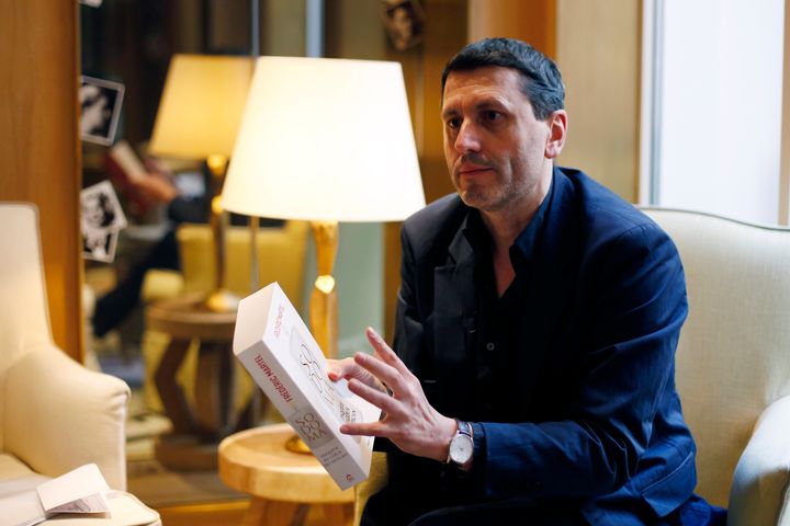 French writer Frederic Martel gestures during an interview with Associated Press, in Paris, Friday, Feb. 15, 2019. 