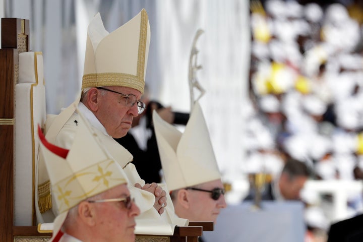 Pope Francis sits in front of the altar as he celebrates a mass at the Sheikh Zayed Sports City Stadium in Abu Dhabi, United Arab Emirates, Tuesday, Feb. 5, 2019.