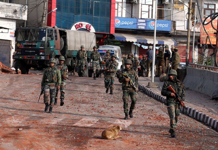 Soldiers patrol during a curfew in Jammu.
