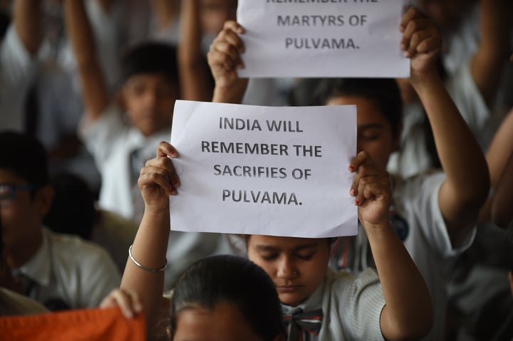 Indian school students pay tribute to the CRPF personnel killed in Kashmir on February 14.