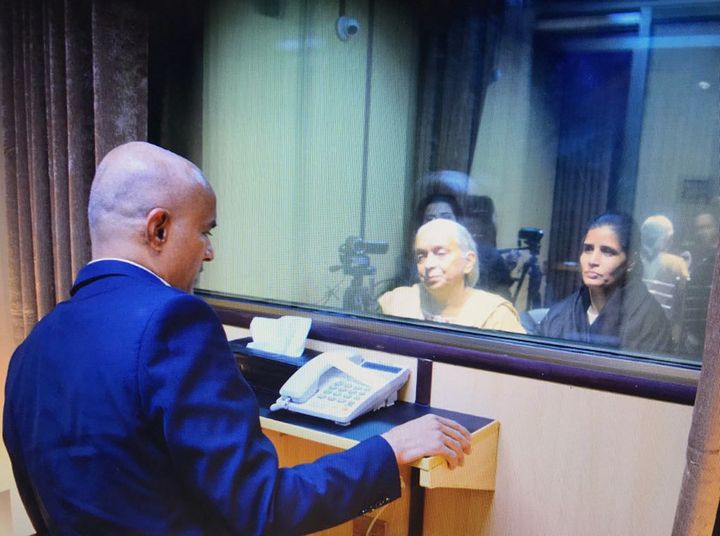 In this handout photo released by Pakistan, the wife, right, and mother, center, of imprisoned Indian naval officer Kulbhushan Jadhav, meet with him at Foreign Ministry in Islamabad, Dec. 25, 2017. 