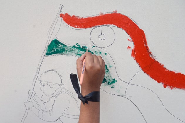 Children paint 100 ft canvas to pay tribute to the martyred 49 CRPF soldiers who lost their lives on...
