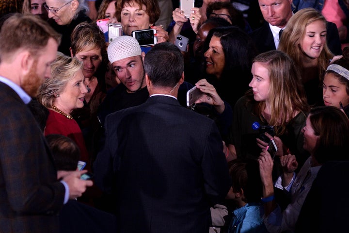 Riches, posing as Muslim, approaches Hillary Clinton in October 2016.