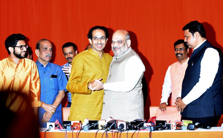 Shiv Sena chief Uddhav Thackeray with BJP president Amit Shah and Maharashtra CM Devendra Fadnavis at a press conference in Mumbai on Monday