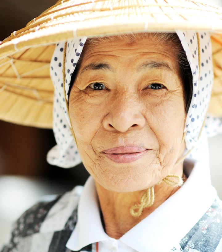An Okinawan woman in traditional clothing. People on the islands have among the longest life spans in the world.