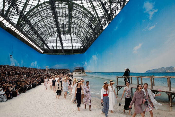 Karl Lagerfeld, top right, watches as models wear creations for the Chanel Spring/Summer 2019 ready-to-wear fashion collection in Paris, on Oct. 2, 2018.