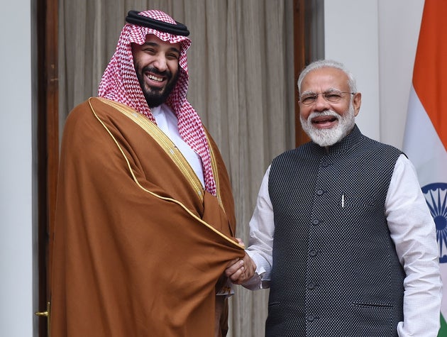 Prime Minister Narendra Modi shakes hands with Saudi Crown Prince Mohammed bin Salman prior to a meeting...