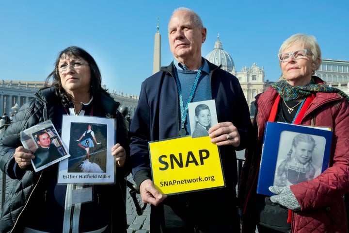 Survivors Network of those Abused by Priests (SNAP) President Tim Lennon from Tucson, Ariz., center, and SNAP members Esther Hatfield Miller from Los Angeles, Calif., left, and Carol Midboe from Austin, pose for pictures during interviews with the media in St. Peter's Square at the Vatican during Pope Francis' general audience, Wednesday, Feb. 20, 2019. 