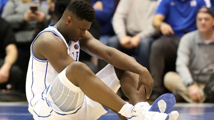 Duke freshman Zion Williamson suffered a knee injury less than a minute into Wednesday's game against North Carolina.