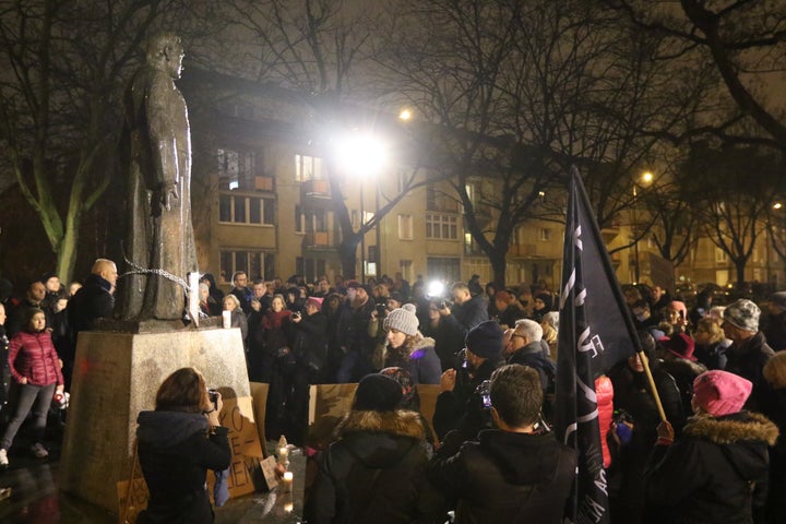 People protest at a monument and square named after priest Henryk Jankowski in Gdansk, Poland, on 7 December 2018. Numerous women and men accused priest Jankowski of sex abuse in '70s when they were children.