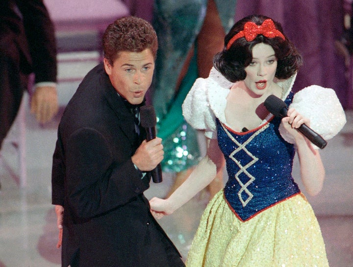 Rob Lowe and Snow White, somehow not a hallucination but rather a shot from the 1989 Oscars.