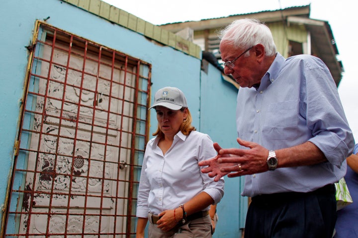 Sen. Bernie Sanders (I- Vt.) talks to the Mayor of San Juan, Carmen Yulin Cruz during a visit to the Playita community in San Juan, Puerto Rico, on October 27, 2017. 