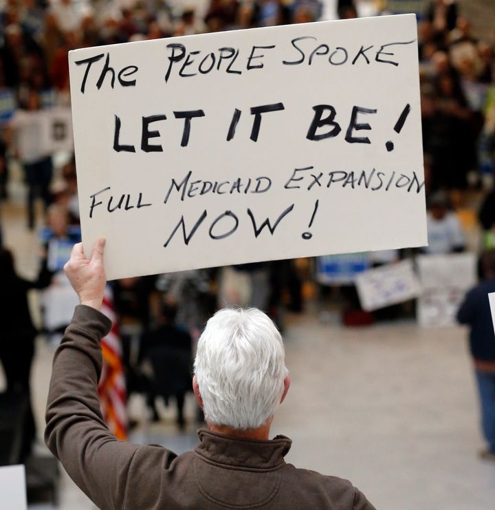 Supporters of a voter-approved measure to fully expand Medicaid gather at a rally to ask lawmakers not to change the law at the Utah State Capitol in Salt Lake City on Jan. 28.