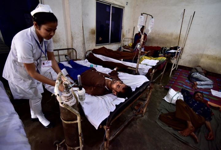 A paramedic tends to a tea plantation worker, who consumed bootleg liquor, inside a government-run hospital in Golaghat in the northeastern state of Assam, India, February 23, 2019. 