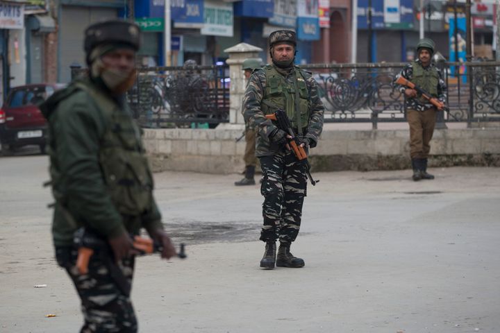Paramilitary soldiers stand guard in a closed market in Srinagar, Kashmir, Feb. 23, 2019.