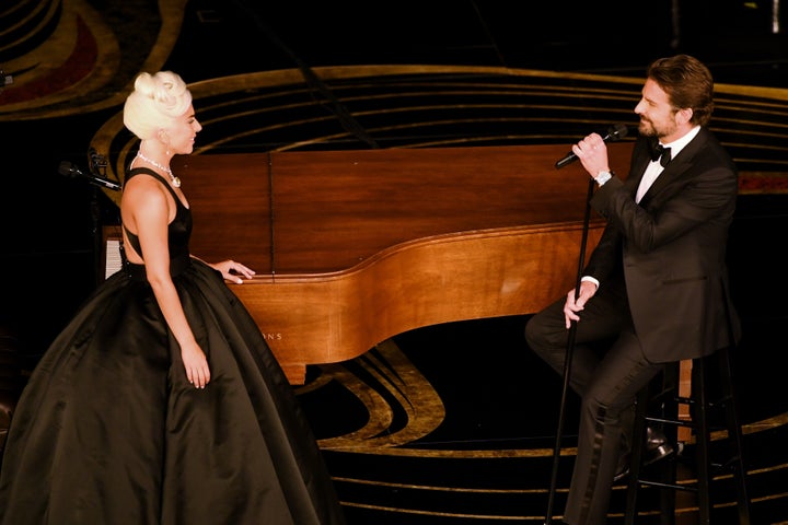 Gaga and Bradley on stage during the Oscars