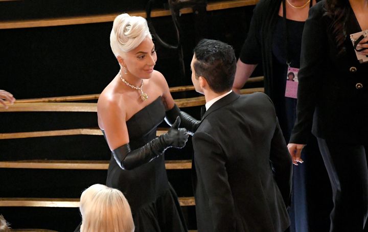 Gaga gave him an adorable thumbs up after fixing the actor's bow tie. 