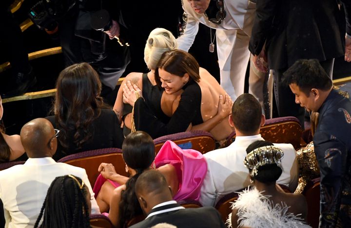 Lady Gaga was hugged by Irina Shayk as she returned to her seat following her performance of Shallow with Bradley Cooper.