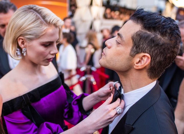 Lucy Boynton and Rami Malek arrive at the Oscars on Sunday, Feb. 24, 2019, at the Dolby Theatre in Los Angeles. 