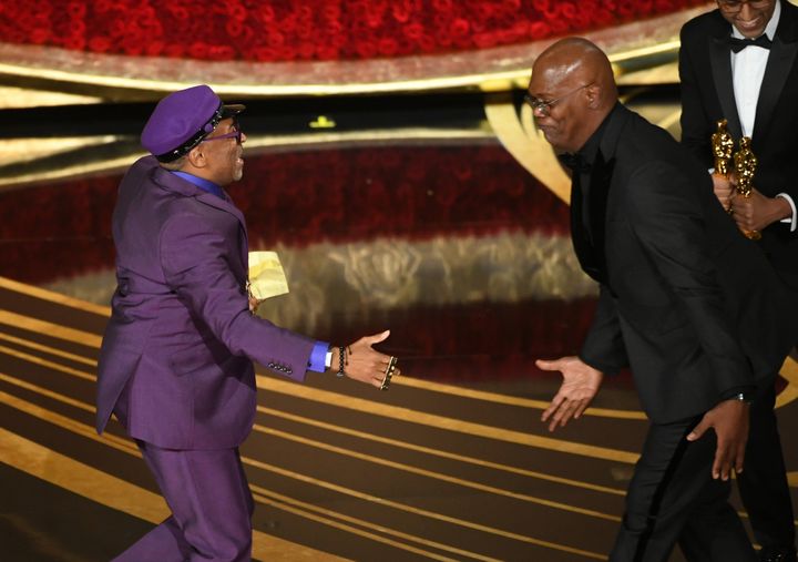 Spike Lee accepts the Adapted Screenplay award for 'BlacKkKlansman' from Samuel L. Jackson onstage during the 91st Annual Academy Awards at Dolby Theatre on February 24, 2019 in Hollywood, California. 