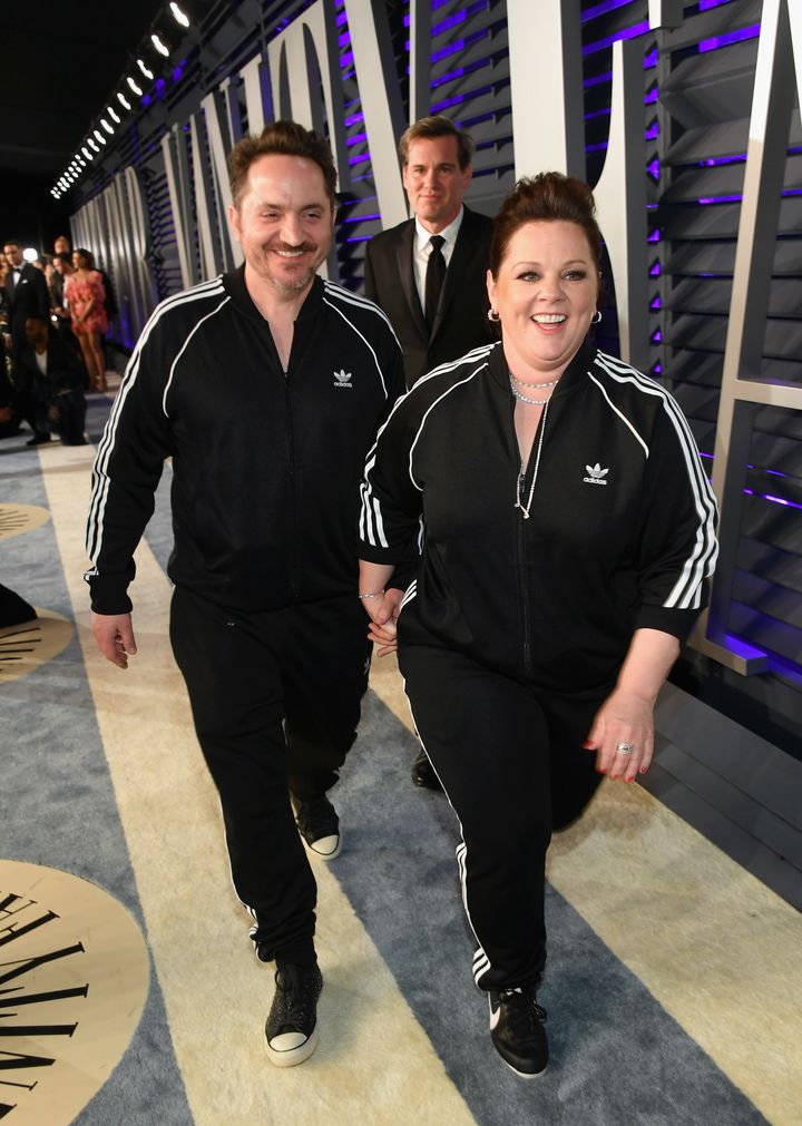 Melissa McCarthy and Ben Falcone walk into the Vanity Fair Oscars party on Sunday.