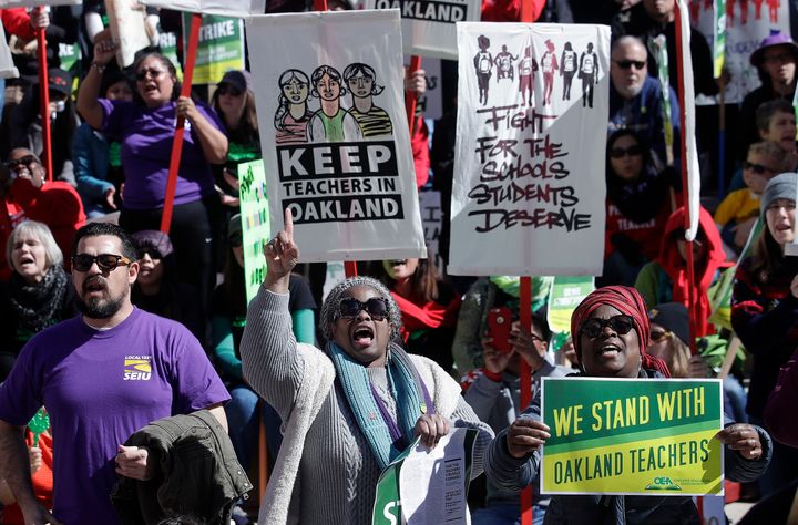 Teachers, students and supporters rally in front of City Hall in Oakland, California, on Feb. 21. The teachers’ union reached a tentative agreement with the school district on March 1.