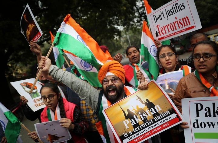 A National Akali Dal leader shouts slogans in support of India and against Pakistan as he celebrates reports of Indian aircra