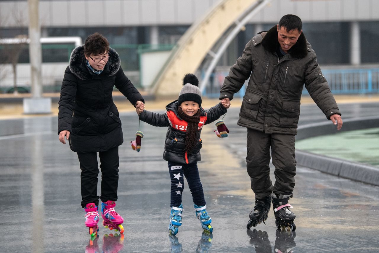 A North Korean child is taught how to roller skate at a skate park on Feb. 6 in Pyongyang.