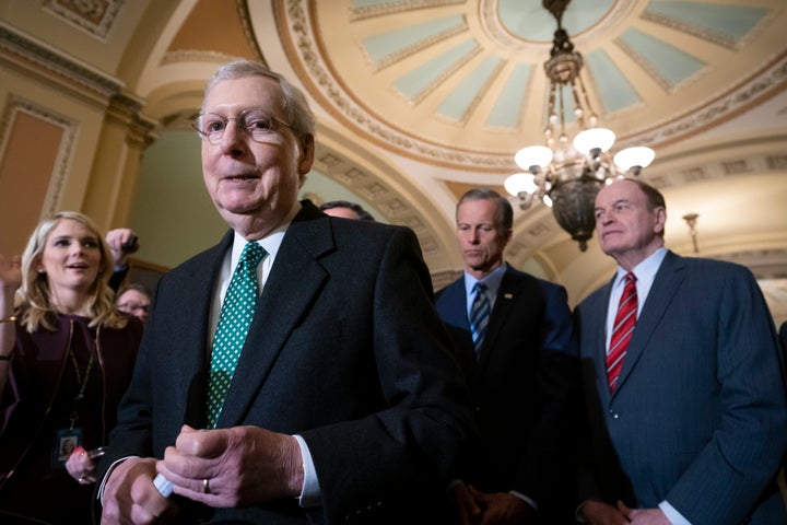 Senate Majority Leader Mitch McConnell (R-Ky.) speaks to reporters on Feb. 12 about the bipartisan compromise worked out to avert another government shutdown.