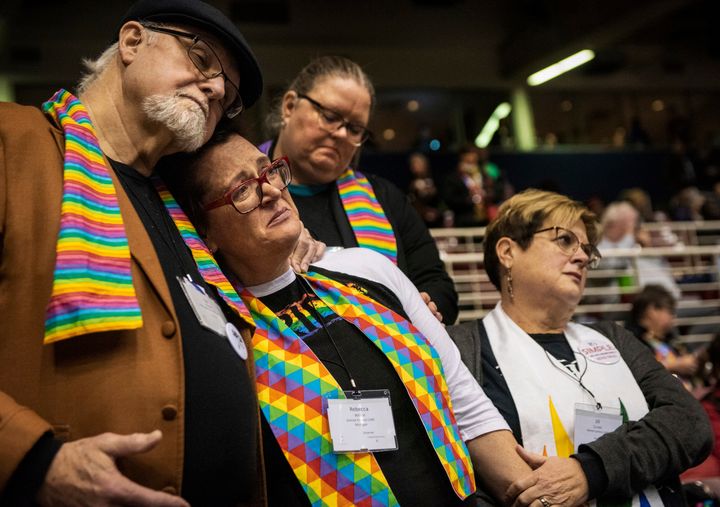Ed Rowe, left, Rebecca Wilson, Robin Hager and Jill Zundel react to the defeat of a proposal that would allow LGBT clergy and same-sex marriage within the United Methodist Church, Feb. 26, 2019. America’s second-largest Protestant denomination faces a likely fracture as delegates at the crucial meeting move to strengthen bans on same-sex marriage and ordination of LGBT clergy.