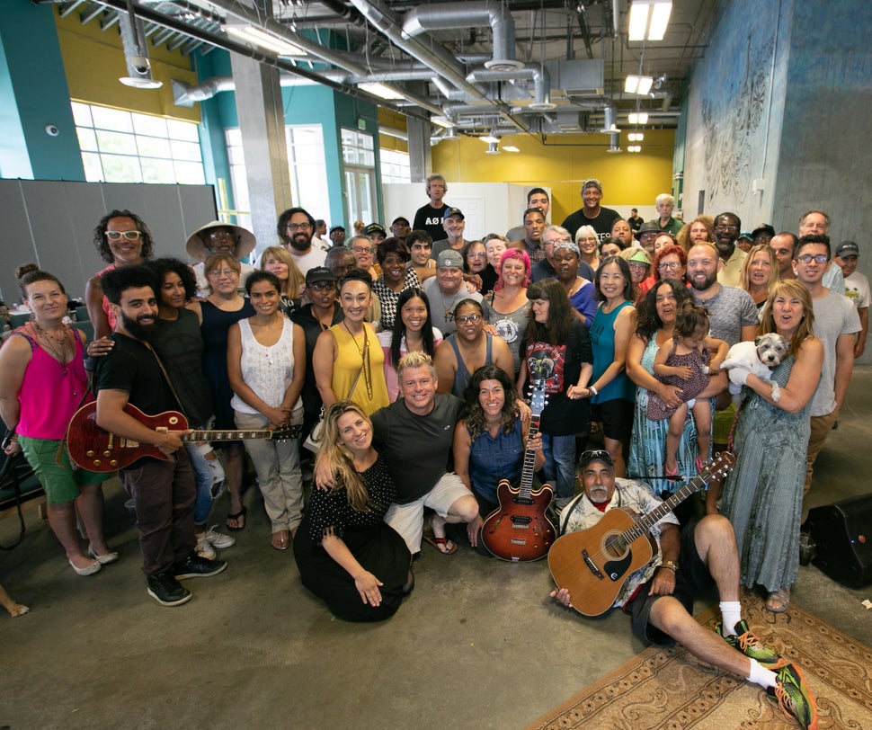 Voices Of Our City Choir rehearsal, with co-founder Steph Johnson (bottom row, third from the left).