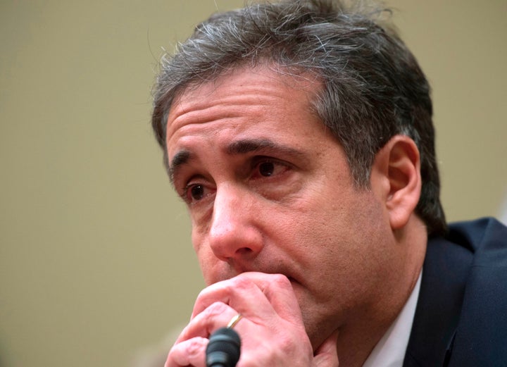 Michael Cohen, Donald Trump's former personal lawyer, tears up after testifying to the House Oversight Committee about the cr