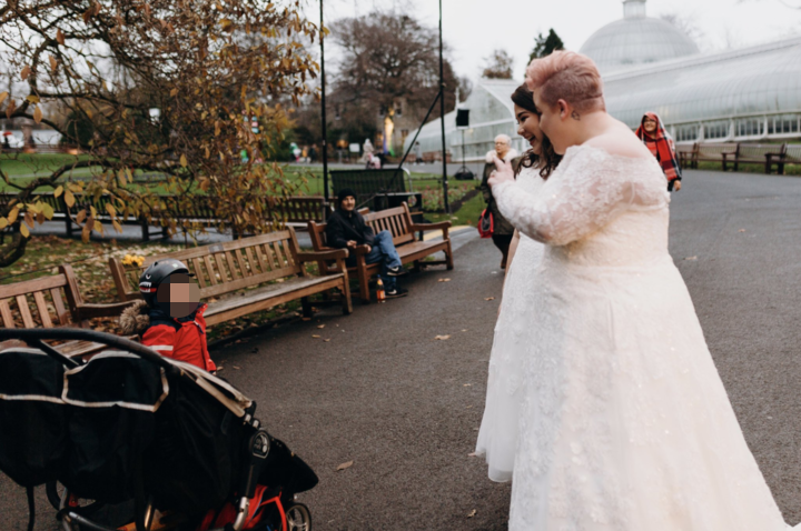 The brides met the young boy and his mom at Glasgow Botanic Gardens.