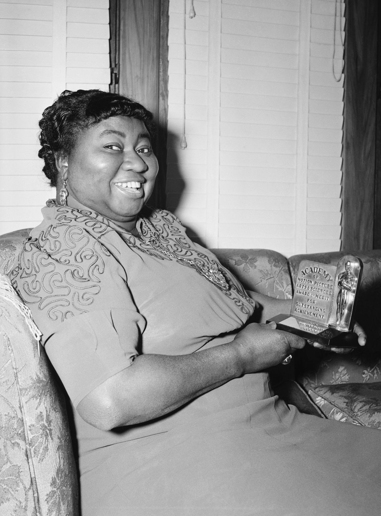 Hattie McDaniel holds her Academy Award after being named "Best Supporting Actress" for her portrayal of "Mammy" in "Gone with the Wind." 