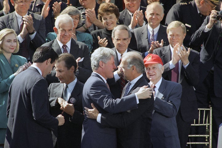 President Bill Clinton hugs then-Sen. Joe Biden in 1994 after signing the Violent Crime Control Act.