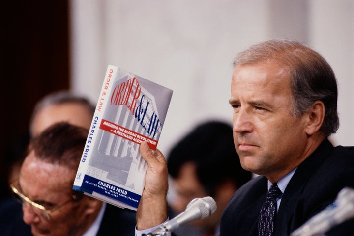 Joe Biden, then chairman of the Senate Judiciary Committee, holds up the book Order and Law by Charles Fried during the Clarence Thomas hearings.