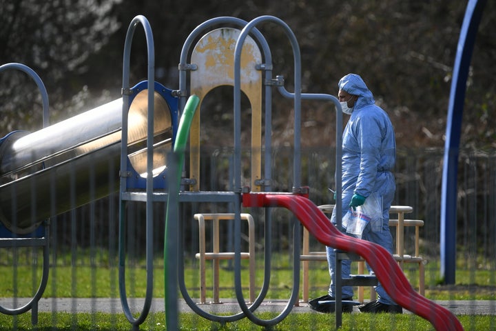 <strong>Police officers search near the scene on St Neot's Road in Harold Hill, east London following the fatal stabbing of a 17-year-old girl on Friday night.</strong>