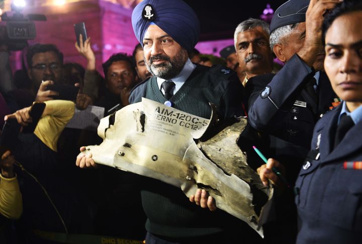  Indian Air Force officials show sections of an exploded AMRAAM missile, said to be fired by Pakistan Air Force (PAF) F-16s which were found in Rajouri district of Kashmir, at an IAF, Army and Navy joint press conference at South Block on February 28, 2019 in New Delhi.