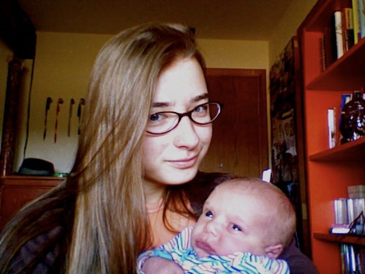 The author, 19 years old, holding baby No. 16, Elijah, in Monument, Colorado, in 2011.